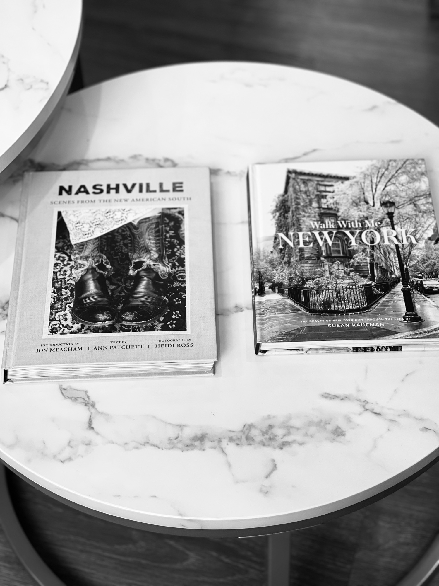 Coffee-table books on a marble side table in the Birdwell & Mutlak waiting area